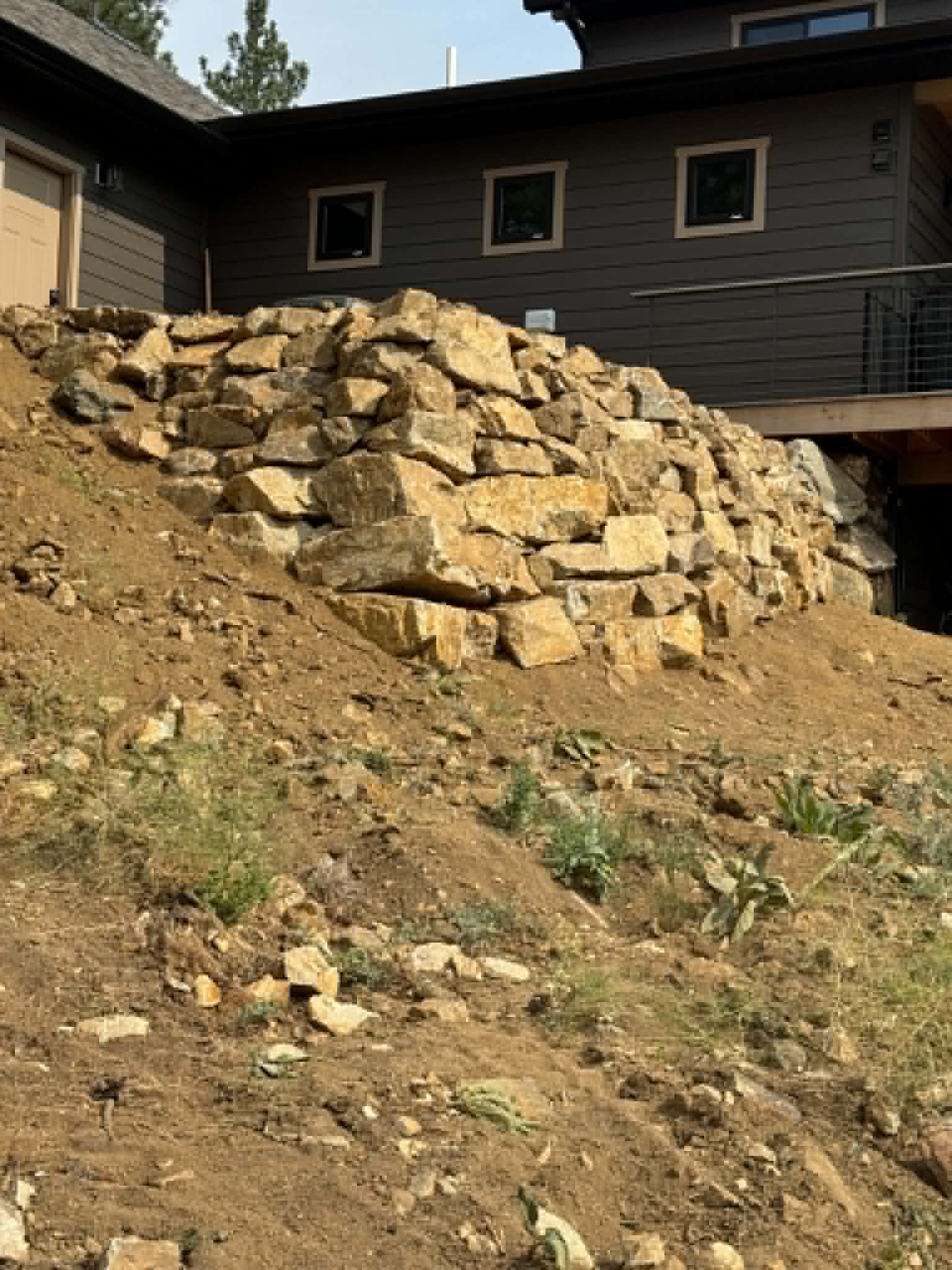 Rock retaining wall installation